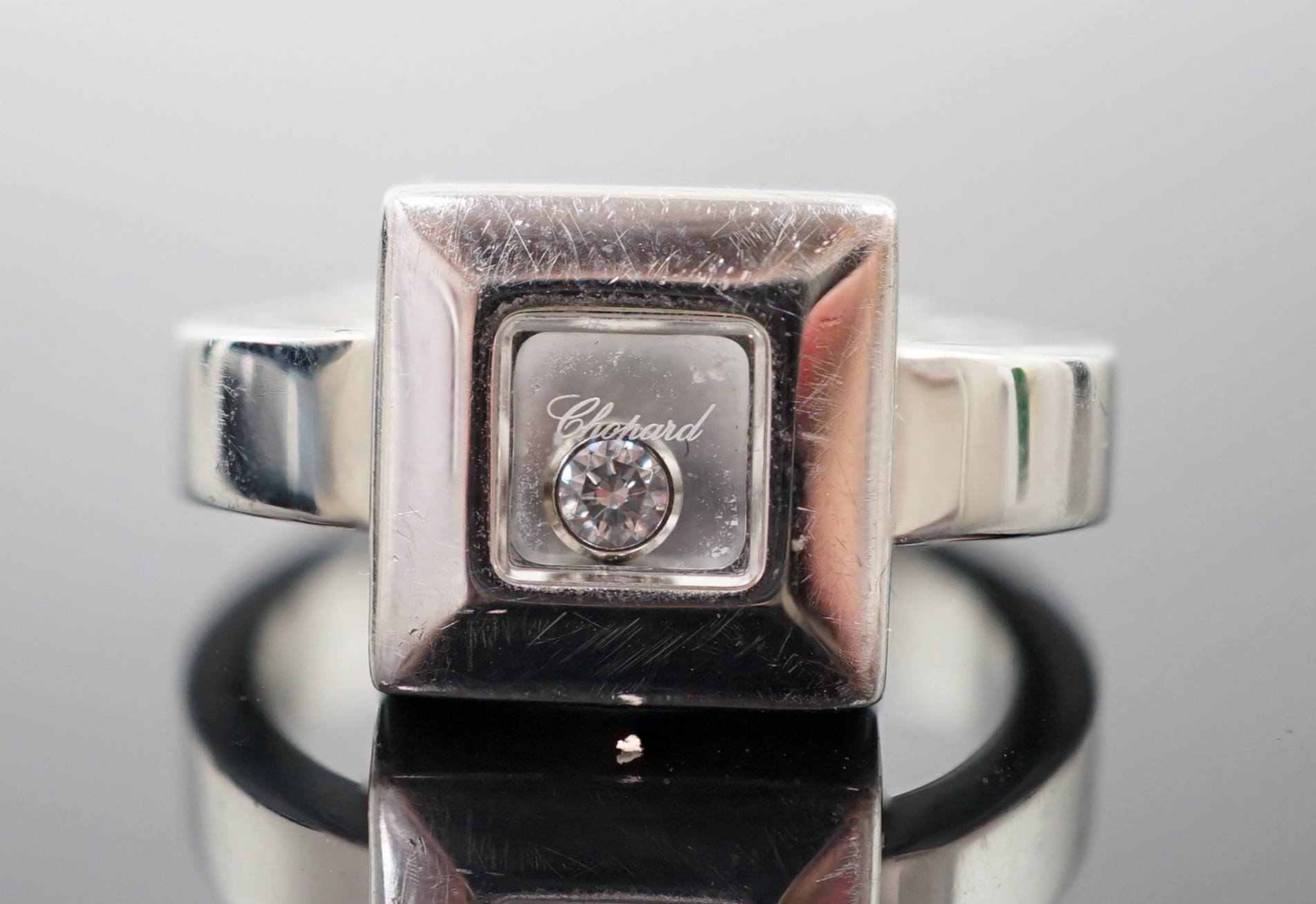 A modern Chopard 18ct white gold 'Happy Floating' diamond ring
